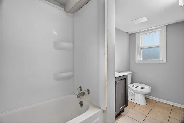 an aerial view of residential houses with city view