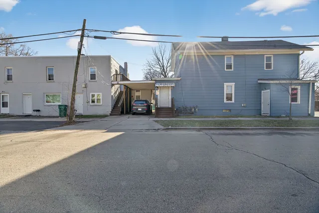 a view of a house with a yard