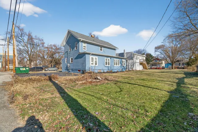 a view of a bedroom with a bed and cabinets