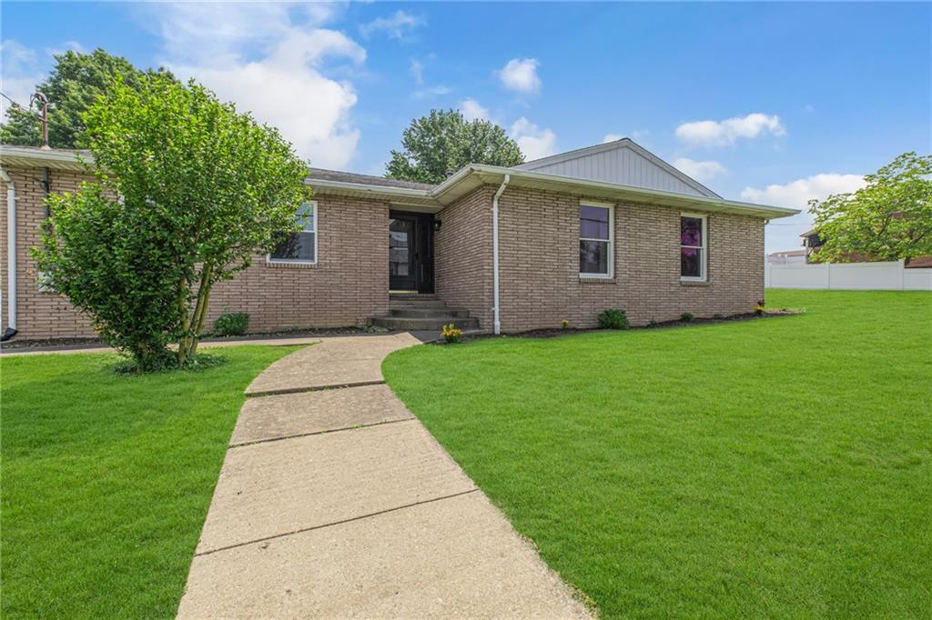 1301 Bechtel Street Monaca, PA 15061 - Photo 1 of 36 a front view of a house with a yard and garage