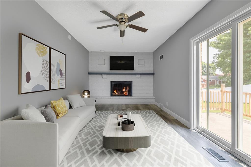 1301 Bechtel Street Monaca, PA 15061 - Photo 12 of 36 a living room with furniture and a fireplace