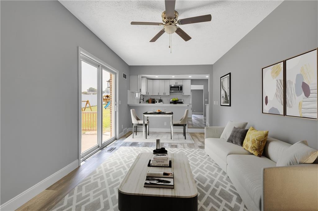 1301 Bechtel Street Monaca, PA 15061 - Photo 14 of 36 a living room with furniture and a large window