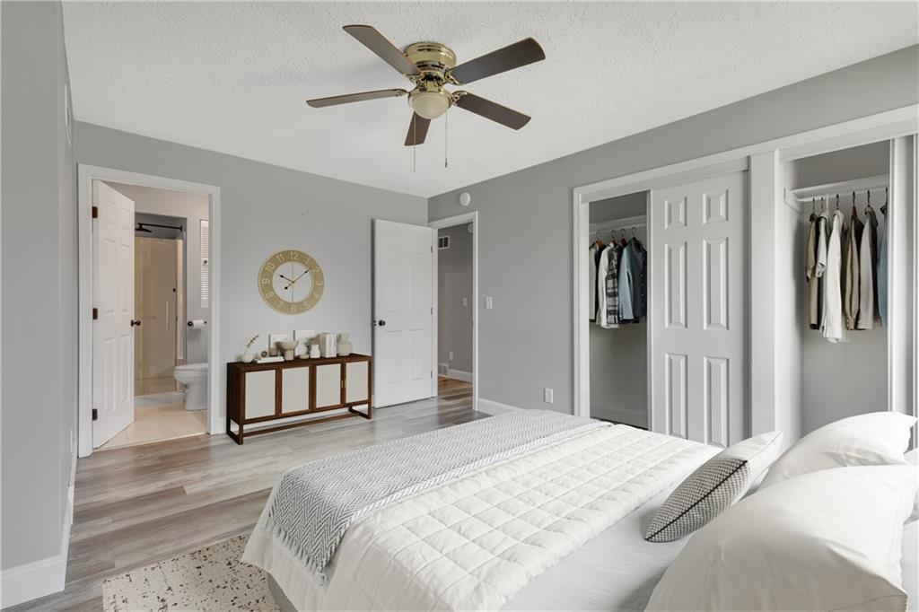 1301 Bechtel Street Monaca, PA 15061 - Photo 16 of 36 a bedroom with a bed and a chandelier