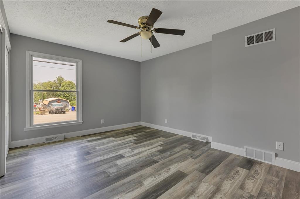1301 Bechtel Street Monaca, PA 15061 - Photo 17 of 36 wooden floor in an empty room with a window