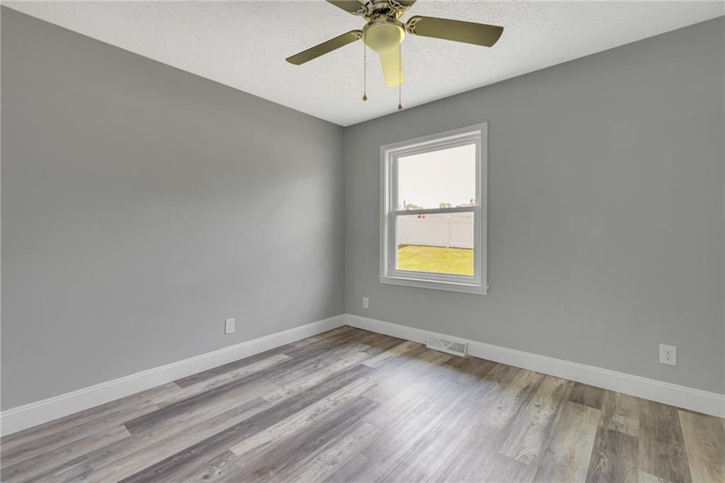 1301 Bechtel Street Monaca, PA 15061 - Photo 26 of 36 wooden floor in an empty room with a window
