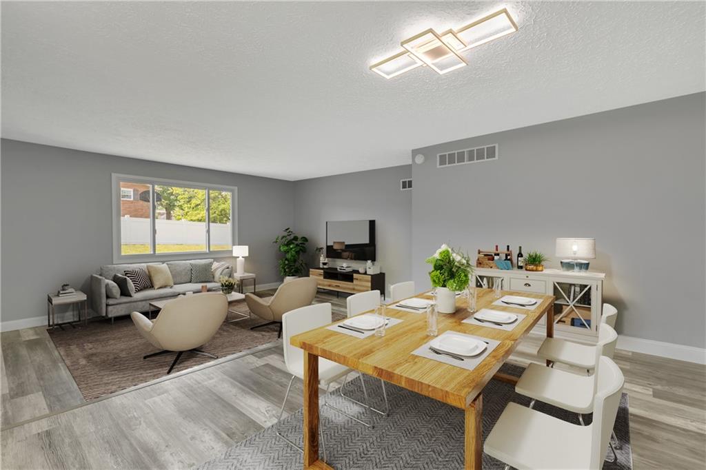 1301 Bechtel Street Monaca, PA 15061 - Photo 7 of 36 a living room with furniture a window and a flat screen tv