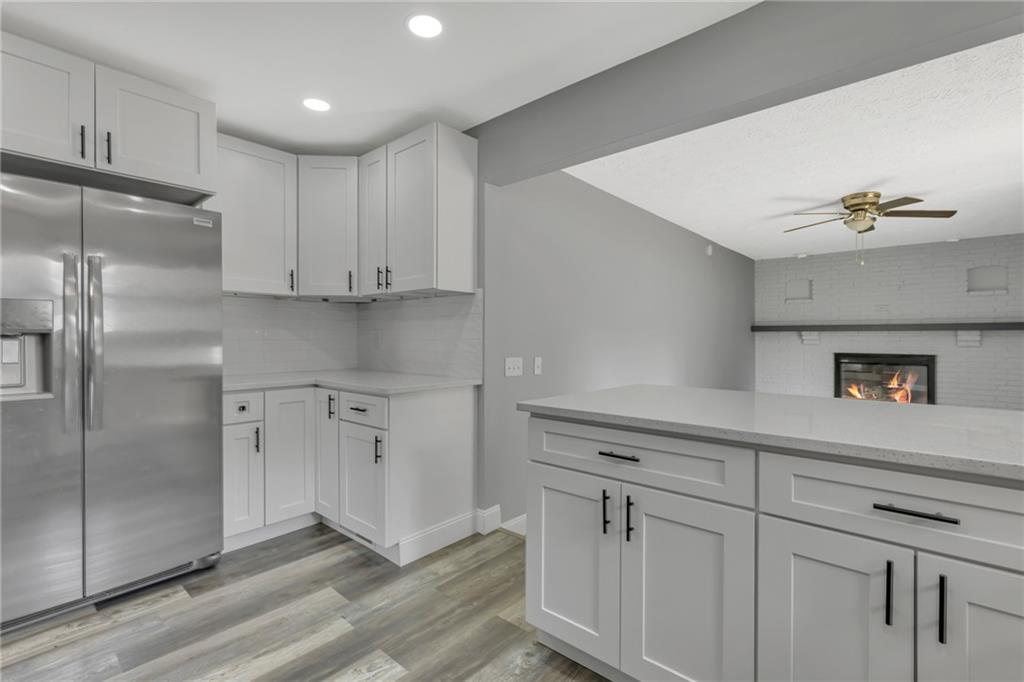 1301 Bechtel Street Monaca, PA 15061 - Photo 10 of 36 a kitchen with white cabinets and white appliances