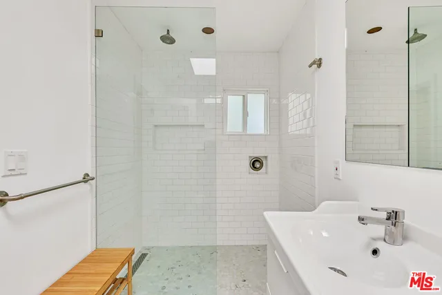 a bathroom with a sink and a shower