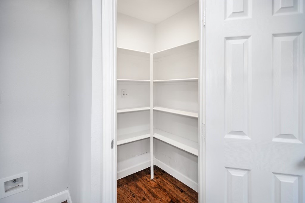 3234 Berry Street Houston, TX 77004 - Photo 18 of 34 a view of walk in closet with empty racks