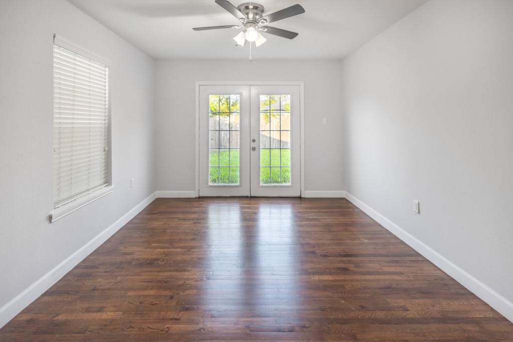 3234 Berry Street Houston, TX 77004 - Photo 22 of 34 an empty room with wooden floor windows and fan