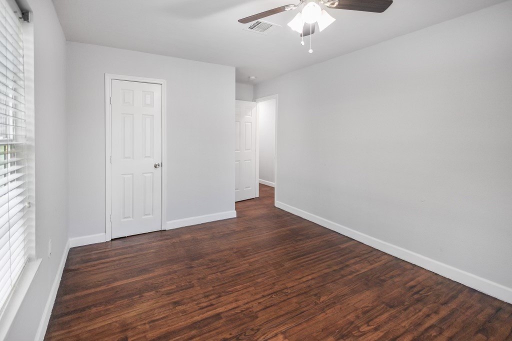 3234 Berry Street Houston, TX 77004 - Photo 27 of 34 a view of an empty room with wooden floor and a window