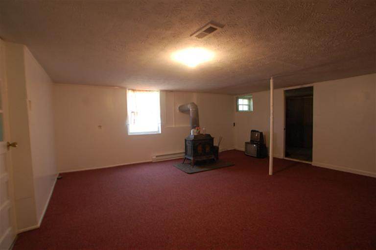 2180 Harris Ferry Road Irvine, KY 40336 - Photo 19 of 27 Large den room with wood-burning stove!