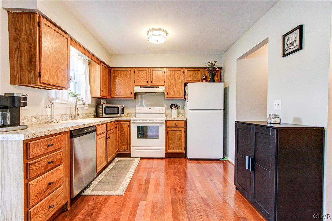 2023 Clover Mill Road Quakertown, PA 18951 - Photo 18 of 48 a kitchen with stainless steel appliances a refrigerator and a stove top oven