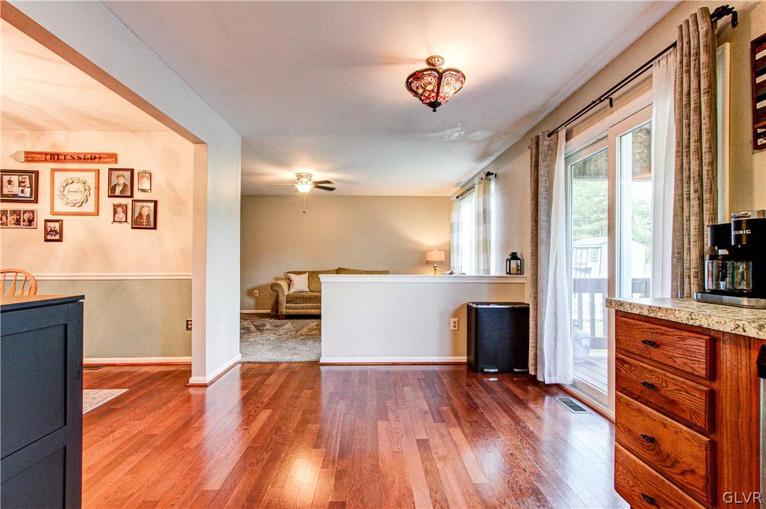 2023 Clover Mill Road Quakertown, PA 18951 - Photo 20 of 48 a view of a hallway with wooden floor and staircase