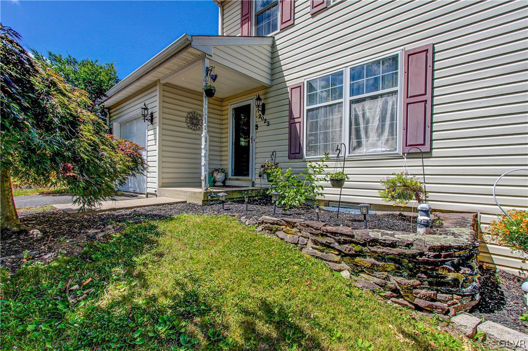 2023 Clover Mill Road Quakertown, PA 18951 - Photo 2 of 48 a front view of a house with garden