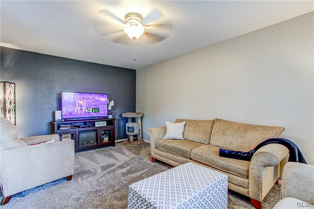 2023 Clover Mill Road Quakertown, PA 18951 - Photo 24 of 48 a living room with furniture and a flat screen tv