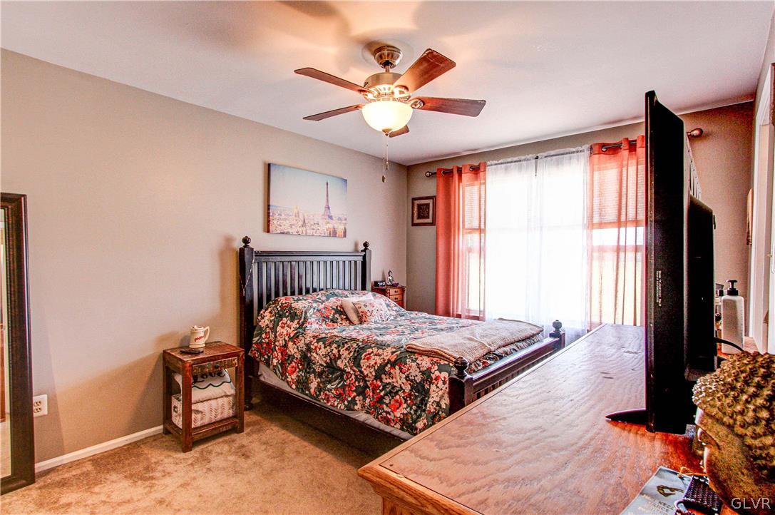 2023 Clover Mill Road Quakertown, PA 18951 - Photo 28 of 48 a bedroom with a bed and a chandelier