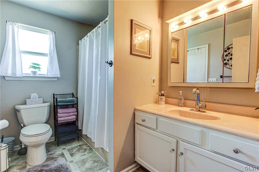 2023 Clover Mill Road Quakertown, PA 18951 - Photo 30 of 48 a bathroom with a toilet sink and mirror