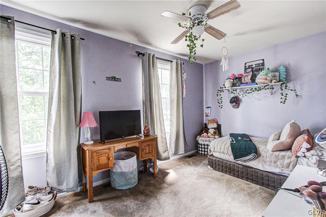 2023 Clover Mill Road Quakertown, PA 18951 - Photo 33 of 48 a living room with furniture and a flat screen tv