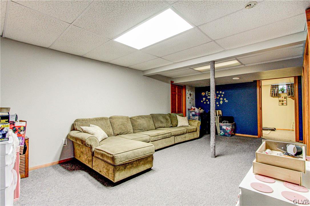 2023 Clover Mill Road Quakertown, PA 18951 - Photo 35 of 48 a living room with furniture and a flat screen tv