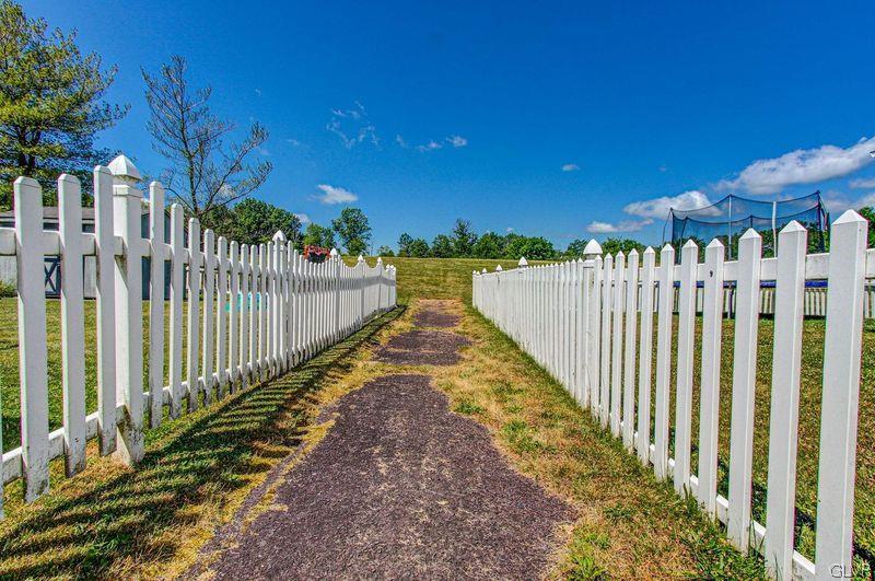 2023 Clover Mill Road Quakertown, PA 18951 - Photo 46 of 48 a view of a pathway with a wrought fence