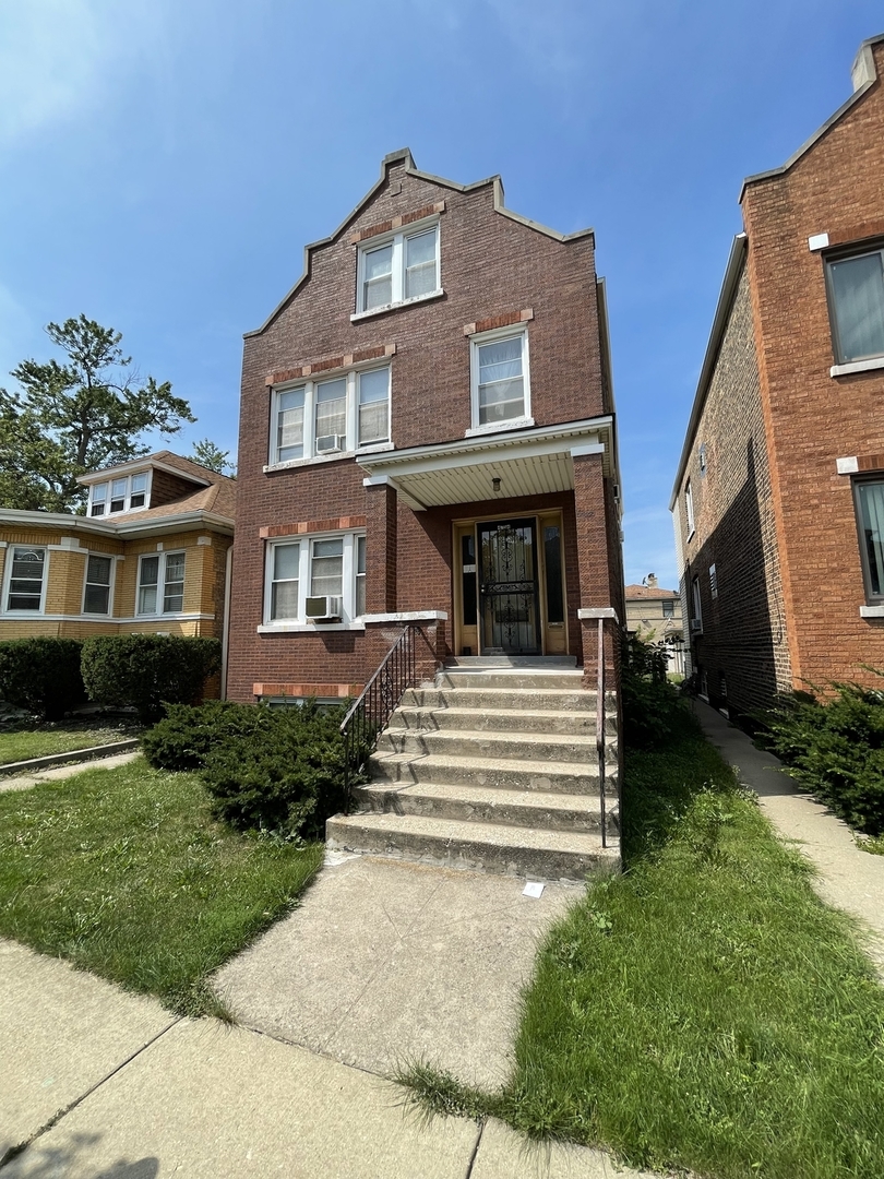 4754 South Springfield Avenue Chicago, IL 60632 - Photo 1 of 12 a view of a house with a yard