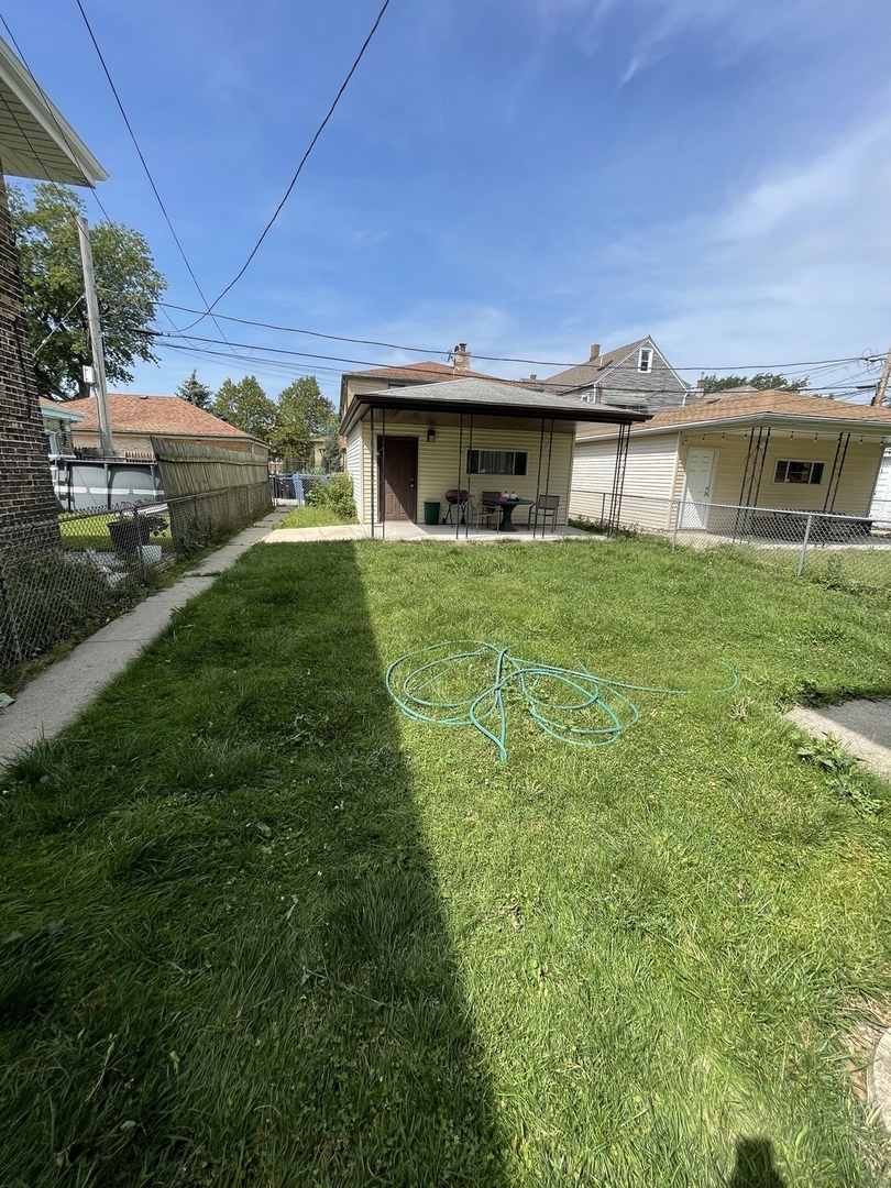 4754 South Springfield Avenue Chicago, IL 60632 - Photo 11 of 12 a front view of a house with garden