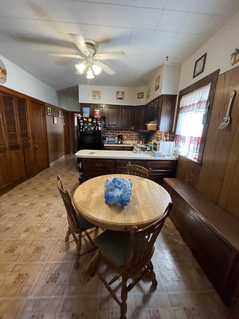 4754 South Springfield Avenue Chicago, IL 60632 - Photo 4 of 12 a dining room with furniture and window
