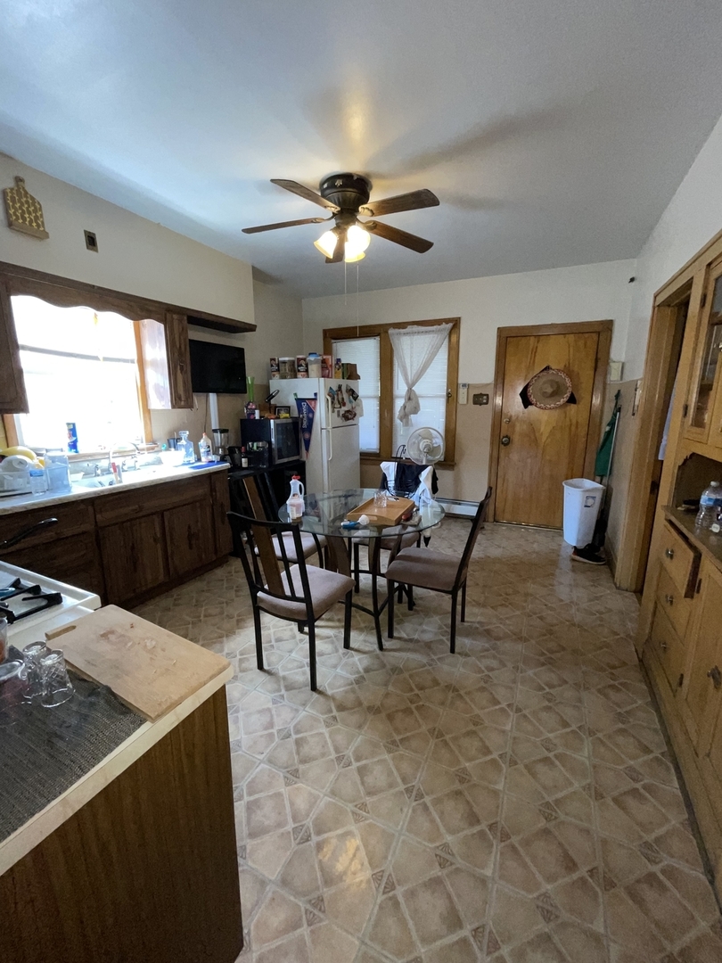 4754 South Springfield Avenue Chicago, IL 60632 - Photo 6 of 12 a view of a dining room with furniture window and wooden floor