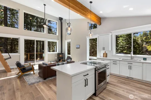 a kitchen that has a sink and a stove in it