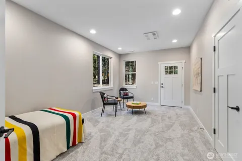 a living room with a couch and chairs