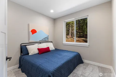 a bedroom with a bed and window