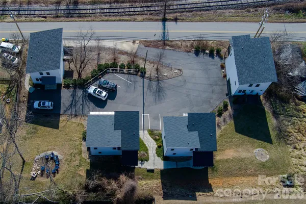 an aerial view of residential houses with outdoor space