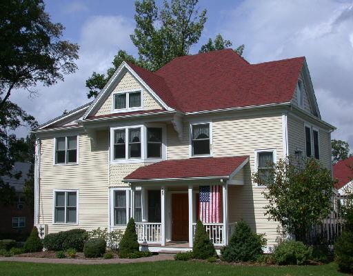 59 Prospect Street, Unit B Ridgefield, CT 06877 - Photo 1 of 1 a front view of a house with a yard
