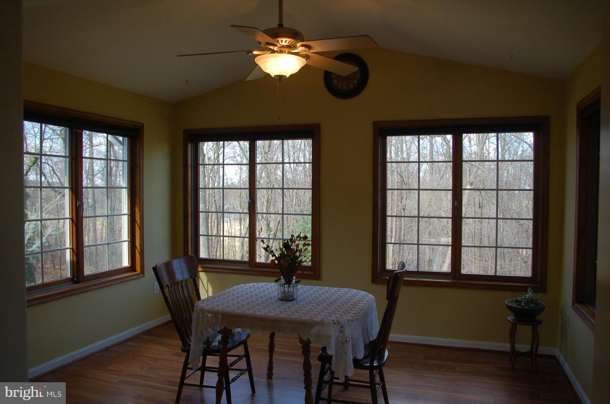 2684 Mt Ventus Road Manchester, MD 21102 - Photo 4 of 23 a view of a dining room with furniture window and wooden floor
