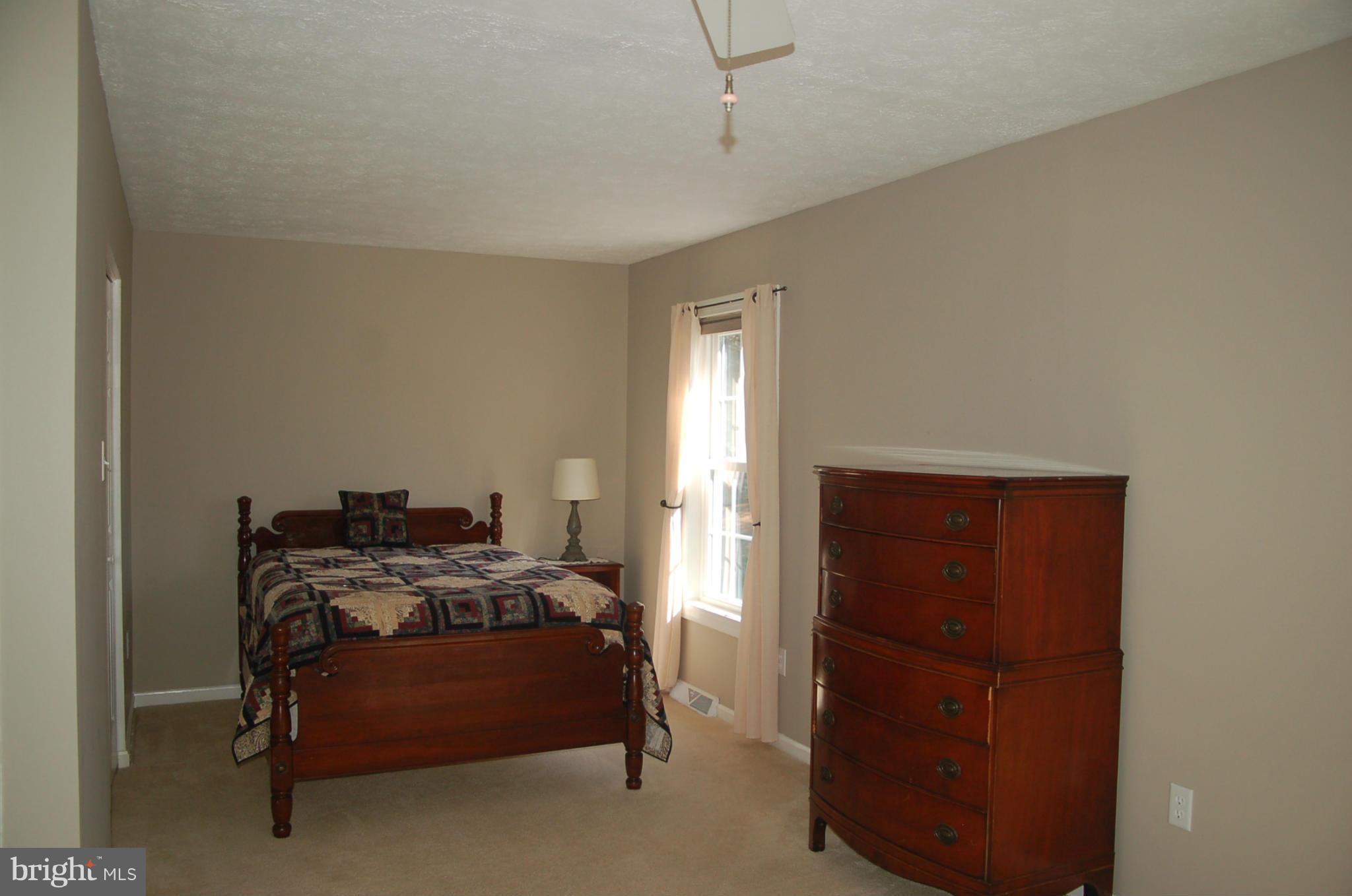 2684 Mt Ventus Road Manchester, MD 21102 - Photo 5 of 23 a bedroom with a bed and a dresser