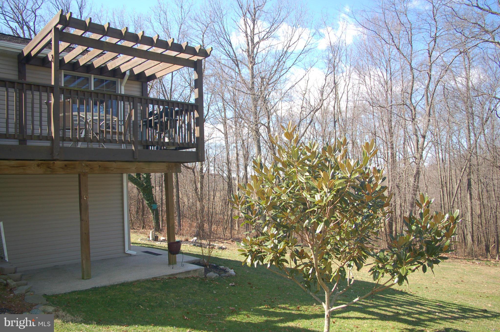 2684 Mt Ventus Road Manchester, MD 21102 - Photo 7 of 23 a backyard of a house with outdoor seating