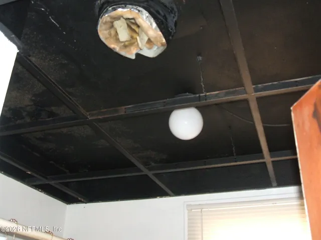 a big room with wooden fence