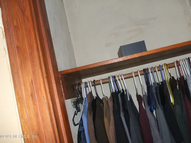 a view of a swimming pool and trees in the background