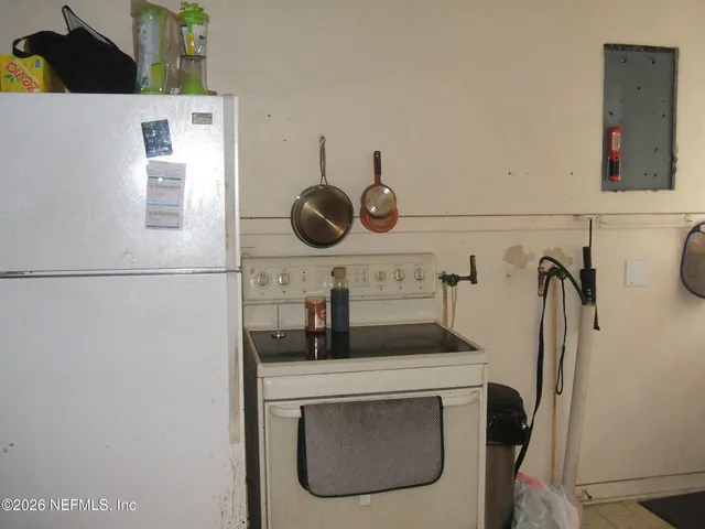 a view of a small pond with green space