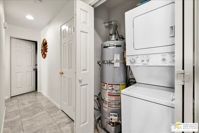 a view of a storage & utility room with dryer and washer