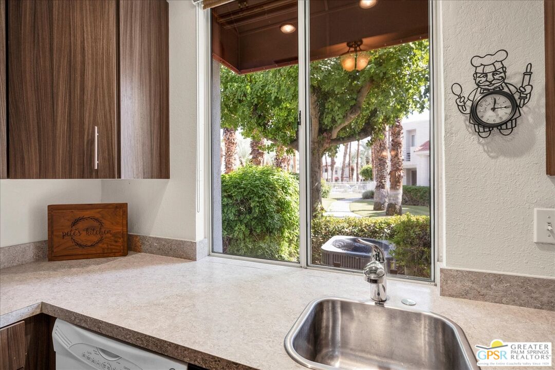 401 El Cielo Road, Unit 147 Palm Springs, CA 92262 - Photo 2 of 44 a bathroom with a sink and a large mirror