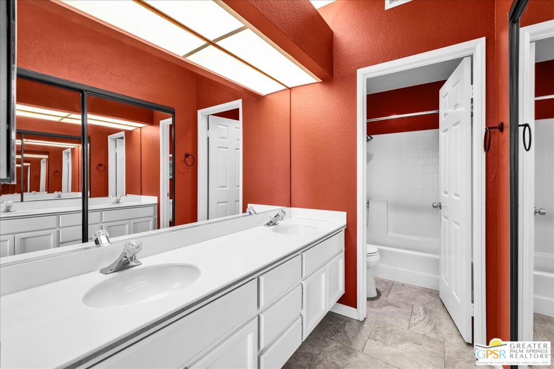 401 El Cielo Road, Unit 147 Palm Springs, CA 92262 - Photo 22 of 44 a bathroom with a sink and a mirror
