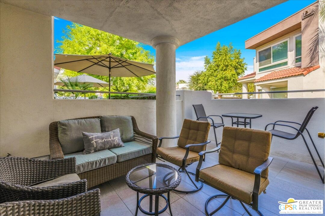 401 El Cielo Road, Unit 147 Palm Springs, CA 92262 - Photo 25 of 44 a blue chair sitting in front of a building