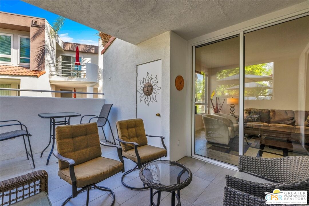 401 El Cielo Road, Unit 147 Palm Springs, CA 92262 - Photo 27 of 44 a living room with furniture and a window