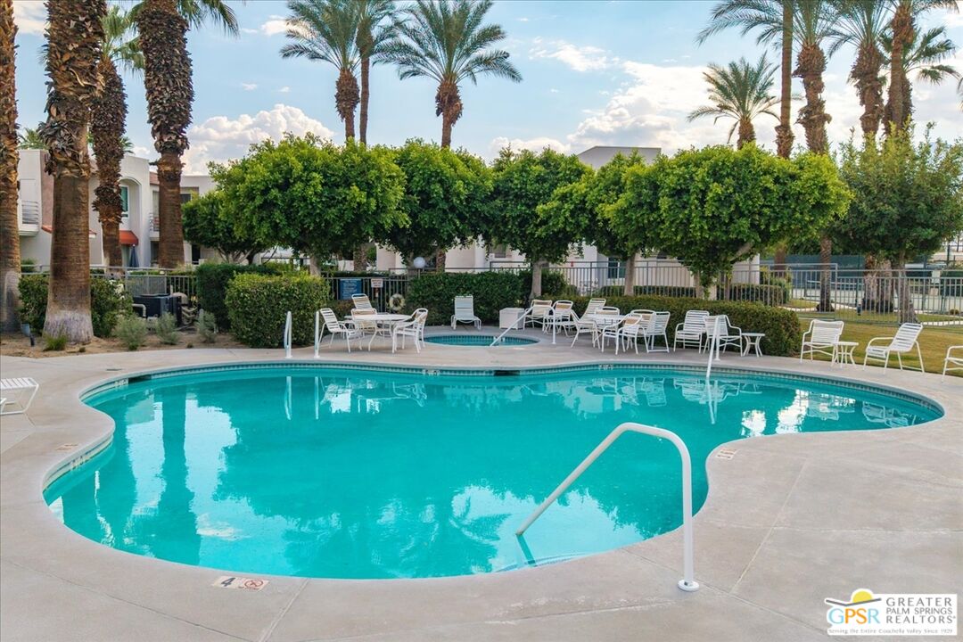 401 El Cielo Road, Unit 147 Palm Springs, CA 92262 - Photo 33 of 44 a view of a swimming pool with a patio