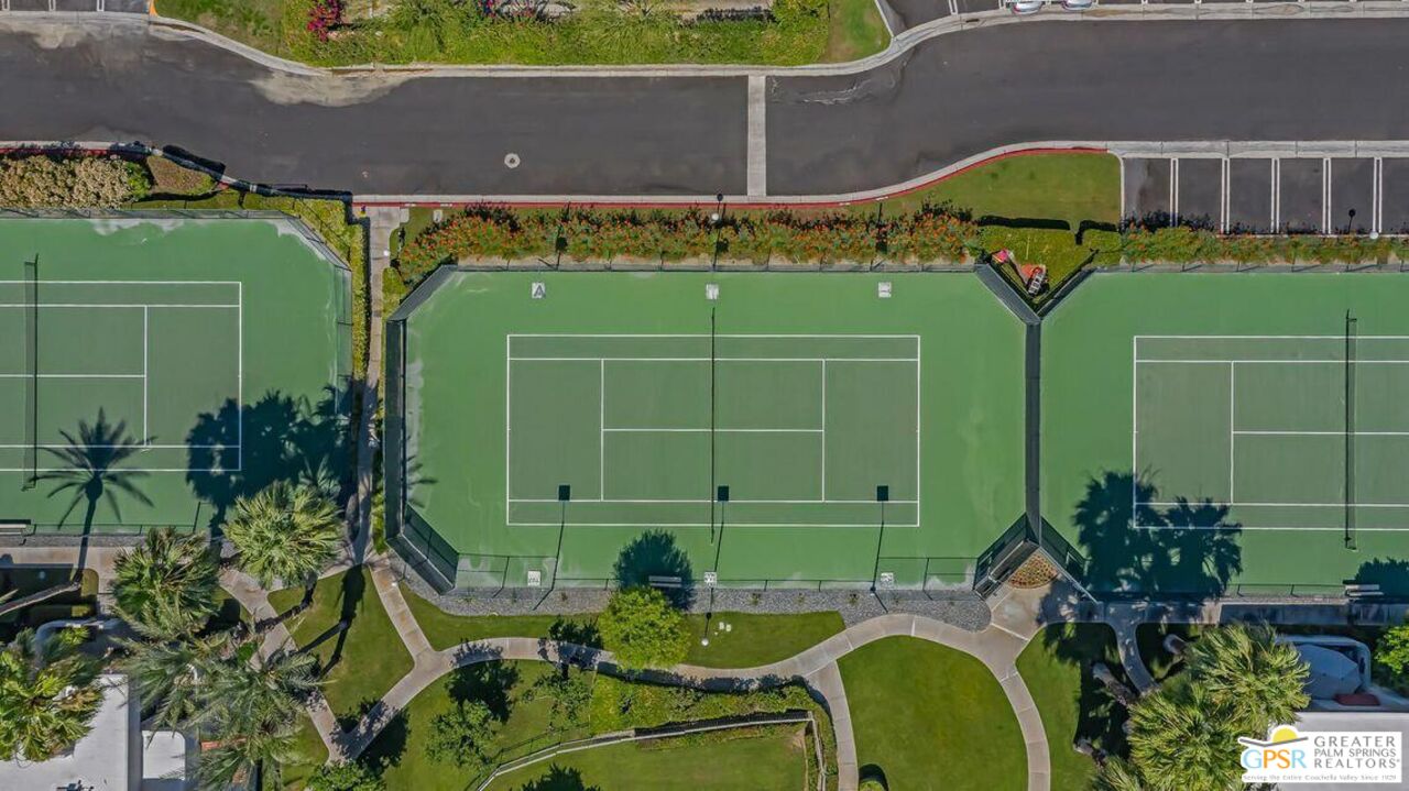 401 El Cielo Road, Unit 147 Palm Springs, CA 92262 - Photo 37 of 44 a green field with some trees in front of it