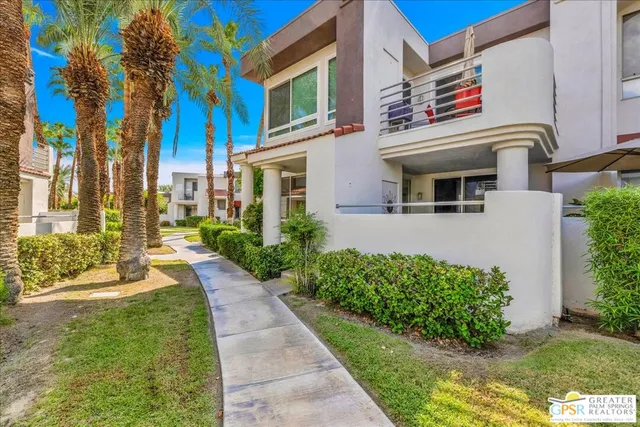 a view of a street with a building in the background