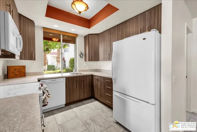a white refrigerator freezer sitting inside of a kitchen