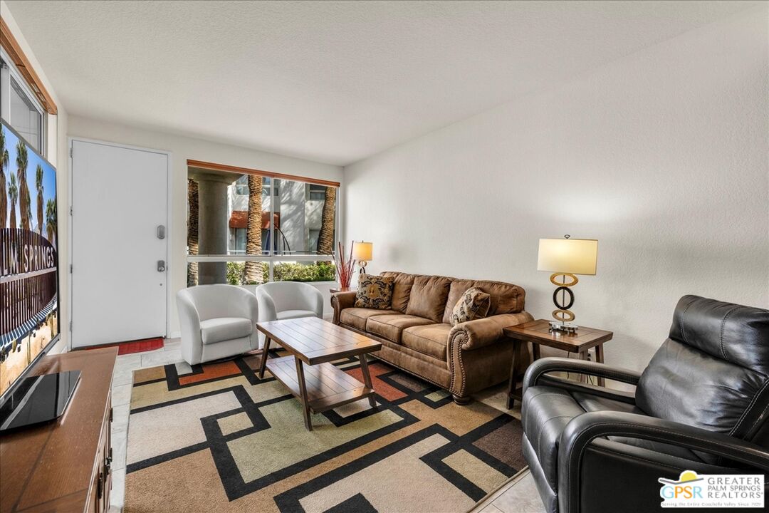 401 El Cielo Road, Unit 147 Palm Springs, CA 92262 - Photo 9 of 44 a living room with furniture and a window